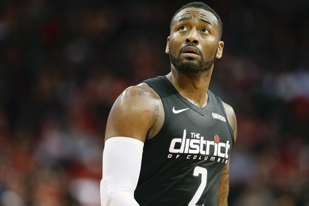 Washington Wizards guard John Wall walks off the court during a timeout during the second half of an NBA basketball game against the Houston Rockets, Wednesday, Dec. 19, 2018, in Houston. (AP Photo/Eric Christian Smith)