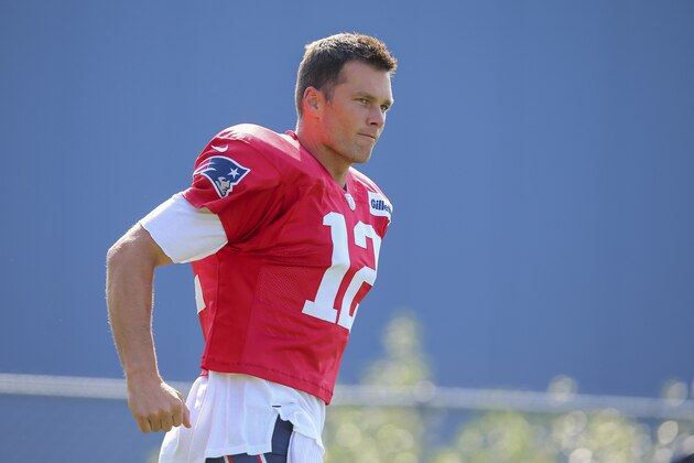New England Patriots quarterback Tom Brady runs onto the practice field prior to an NFL football training camp practice in Foxborough, Mass., Saturday, July 27, 2019. (AP Photo/Stew Milne)