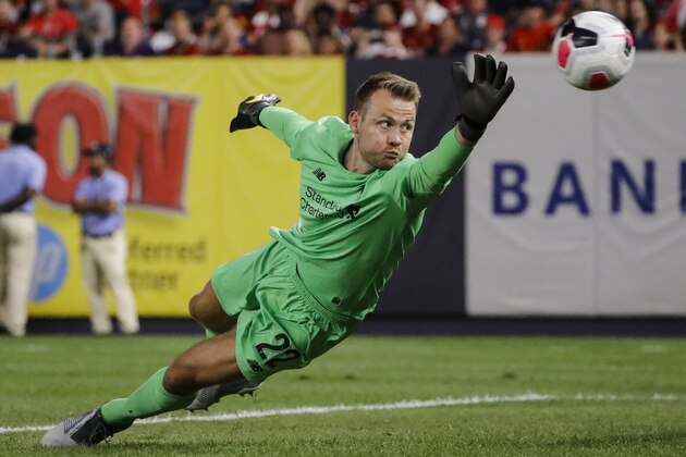 Liverpool FC's goalkeeper Simon Mignolet dives for the ball during the first half of a soccer match against Sporting CP Wednesday, July 24, 2019, in New York. (AP Photo/Frank Franklin II)