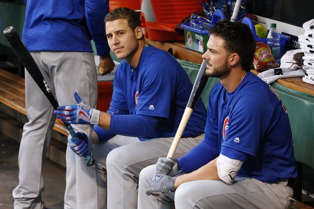 Chicago Cubs' Anthony Rizzo, left, and Kris Bryant sit in the dugout before a baseball game against the Pittsburgh Pirates in Pittsburgh, Tuesday, May 3, 2016. (AP Photo/Gene J. Puskar)