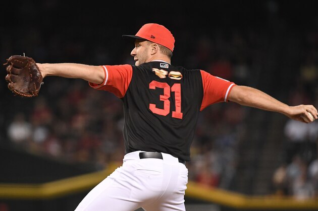 PHOENIX, AZ - AUGUST 26:  Brad Boxberger #31 of the Arizona Diamondbacks delivers a pitch in the ninth inning of the MLB game against the Seattle Mariners at Chase Field on August 26, 2018 in Phoenix, Arizona. All players across MLB wear nicknames on their backs as well as colorful, non-traditional uniforms featuring alternate designs inspired by youth-league uniforms during Players Weekend. The Arizona Diamondbacks won 5-2. (Photo by Jennifer Stewart/Getty Images)