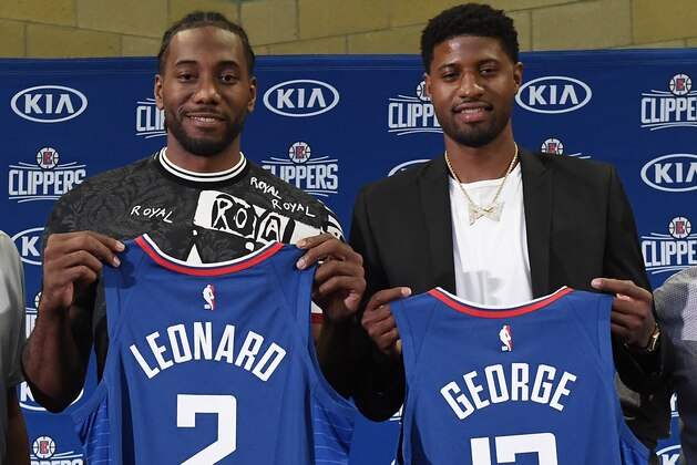 LOS ANGELES, CA - JULY 24: Kawhi Leonard and Paul George pose after a news conference where both players were introduced as new Los Angeles Clippers at Green Meadows Recreation Center on July 24, 2019 in Los Angeles, California. NOTE TO USER: User expressly acknowledges and agrees that, by downloading and or using this photograph, User is consenting to the terms and conditions of the Getty Images License Agreement. at Green Meadows Recreation Center on July 24, 2019 in Los Angeles, California. (Photo by Kevork Djansezian/Getty Images)