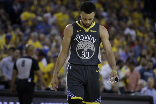 Golden State Warriors' Stephen Curry walks on the court during a timeout in the second quarter of Game 6 of basketball's NBA Finals against the Toronto Raptors Thursday, June 13, 2019, in Oakland, Calif. (AP Photo/Ben Margot)