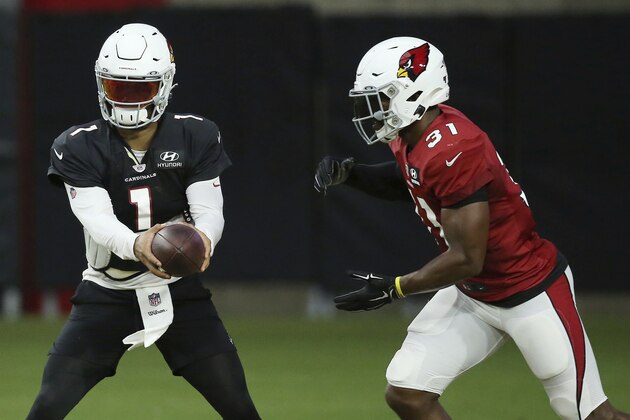 Arizona Cardinals quarterback Kyler Murray (1) hands the ball off to Cardinals running back David Johnson (31) during an NFL football training camp practice at State Farm Stadium Tuesday, Aug. 6, 2019, in Glendale, Ariz. (AP Photo/Ross D. Franklin)