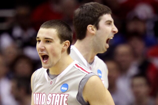 CLEVELAND, OH - MARCH 20: Aaron Craft #4 and Jon Diebler #33 of the Ohio State Buckeyes celebrate after a play in the first half against the George Mason Patriots during the third of the 2011 NCAA men's basketball tournament at Quicken Loans Arena on March 20, 2011 in Cleveland, Ohio.  (Photo by Andy Lyons/Getty Images)