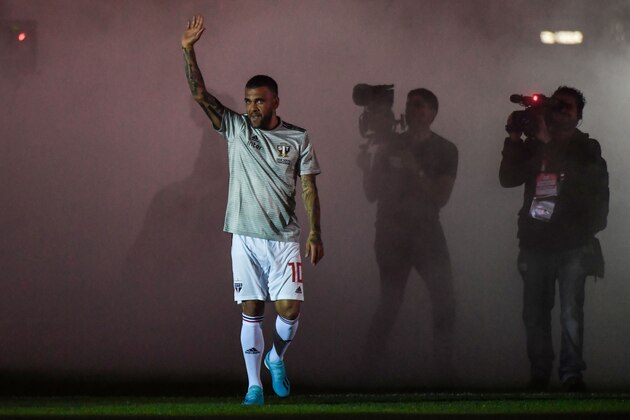 Brazil's national football team captain Dani Alves, waves to supporters during his official presentation in his new team Sao Paulo FC, at Morumbi stadium in Sao Paulo, Brazil, on August 6, 2019. (Photo by NELSON ALMEIDA / AFP)        (Photo credit should read NELSON ALMEIDA/AFP/Getty Images)