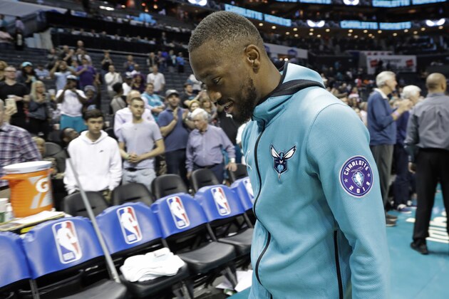 Charlotte Hornets' Kemba Walker eaves the court after the team's NBA basketball game against the Orlando Magic in Charlotte, N.C., Wednesday, April 10, 2019. (AP Photo/Chuck Burton)