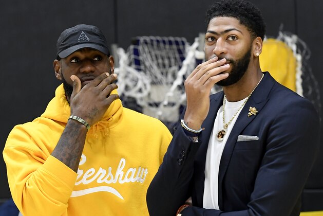 EL SEGUNDO, CALIFORNIA - JULY 13: Anthony Davis (R) talks with LeBron James as Davis is introduced as the newest player of the Los Angeles Lakers during a press conference at UCLA Health Training Center on July 13, 2019 in El Segundo, California. NOTE TO USER: User expressly acknowledges and agrees that, by downloading and/or using this Photograph, user is consenting to the terms and conditions of the Getty Images License Agreement. (Photo by Kevork Djansezian/Getty Images)