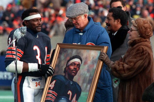 Chicago Bears' Walter Payton, right, receives a painting of his likeness from Bears owners Ed and Virginia McCaskey  on Dec. 20, 1987 inn Chicago during Payton's last NFL season Payton, the NFL's greatest rusher whose aggressive style masked a playful temperament that earned him the nickname ``Sweetness,'' died Monday Nov. 1, 1999 at age 45.  (AP Photo/Mark  Elias)