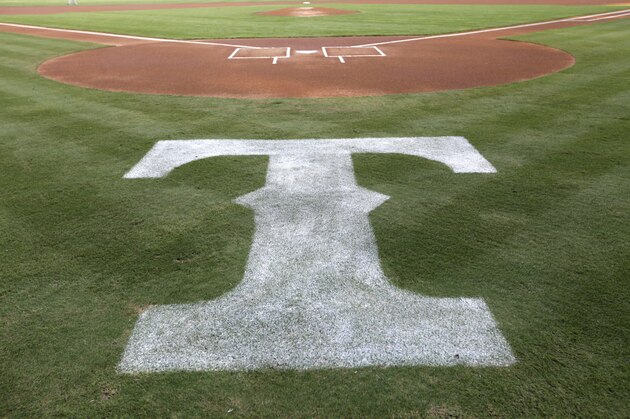 The Texas Rangers logo is shown behind the batters box before a baseball game against the Tampa Bay Rays Tuesday, Aug. 28, 2012, in Arlington, Texas. The Rangers won 1-0. (AP Photo/Tony Gutierrez)