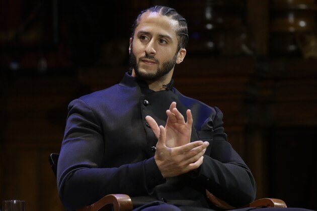FILE - In this Oct. 11, 2018, file photo, former NFL football quarterback Colin Kaepernick applauds while seated on stage during W.E.B. Du Bois Medal ceremonies at Harvard University in Cambridge, Mass. Republican concerns that the former NFL quarterback is too controversial to honor as a black leader doomed a resolution recognizing Black History Month in the state Assembly, Tuesday, Feb. 12, 2019. The Legislature's black caucus had proposed a resolution honoring a number of black leaders, including Kaepernick, but Assembly Republicans refused to take it up. (AP Photo/Steven Senne, File)