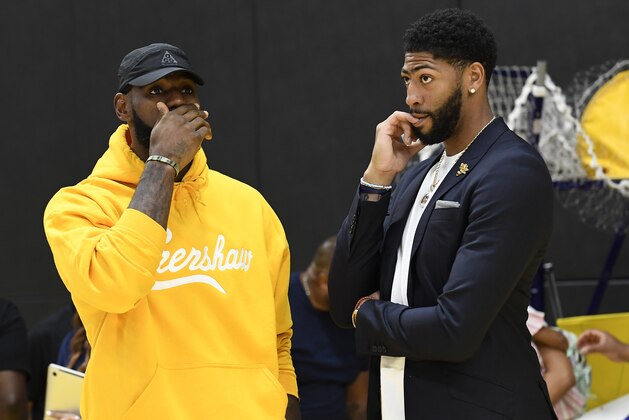EL SEGUNDO, CA - JULY 13: LeBron James (L) talks with Anthony Davis after a press conference where Davis was introduced as the newest player of the Los Angeles Lakers at UCLA Health Training Center on July 13, 2019 in El Segundo, California. NOTE TO USER: User expressly acknowledges and agrees that, by downloading and/or using this Photograph, user is consenting to the terms and conditions of the Getty Images License Agreement. (Photo by Kevork Djansezian/Getty Images)