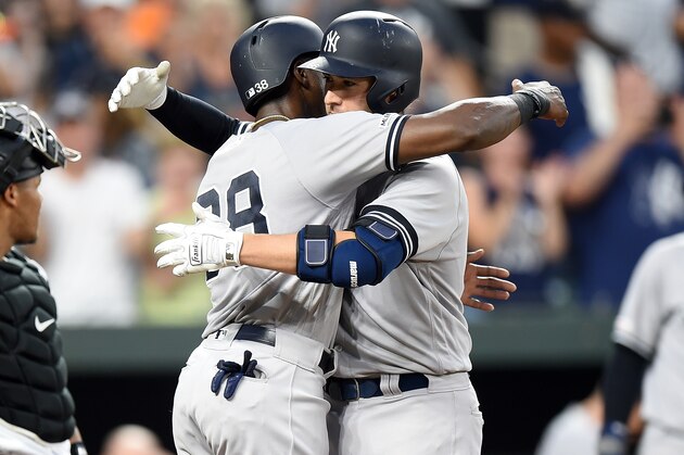 BALTIMORE, MD - AUGUST 07:  Kyle Higashioka #66 of the New York Yankees celebrates with Cameron Maybin #38 after hitting a three-run home run in the fourth inning against the Baltimore Orioles at Oriole Park at Camden Yards on August 7, 2019 in Baltimore, Maryland.  (Photo by Greg Fiume/Getty Images)