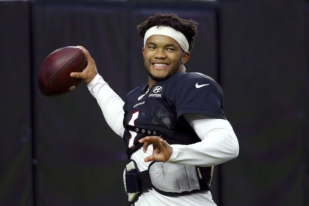 Arizona Cardinals quarterback Kyler Murray smiles as he throws a pass during an NFL football training camp practice at State Farm Stadium Tuesday, Aug. 6, 2019, in Glendale, Ariz. (AP Photo/Ross D. Franklin)
