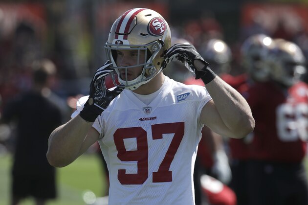 San Francisco 49ers' Nick Bosa adjusts his helmet at the team's NFL football training camp in Santa Clara, Calif., Saturday, July 27, 2019. (AP Photo/Jeff Chiu)