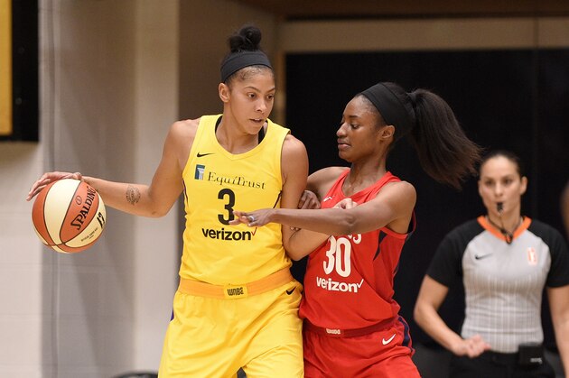 Los Angeles Sparks forward Candace Parker (3) dribbles against Washington Mystics forward LaToya Sanders (30) in the first half of a single elimination WNBA basketball playoff game, Thursday, Aug. 23, 2018, in Washington. (AP Photo/Nick Wass)