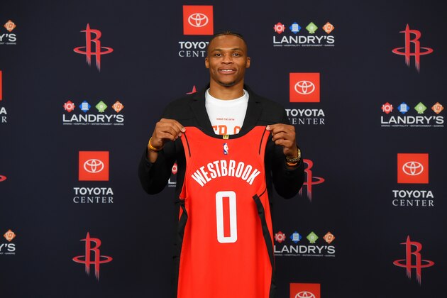 HOUSTON, TX - JULY 26: Russell Westbrook #0 of the Houston Rockets pose for a photo during the Houston Rockets Introductory Press Conference on July 26, 2019 at the Toyota Center in Houston, Texas. NOTE TO USER: User expressly acknowledges and agrees that, by downloading and or using this photograph, User is consenting to the terms and conditions of the Getty Images License Agreement. Mandatory Copyright Notice: Copyright 2019 NBAE (Photo by Bill Baptist/NBAE via Getty Images)