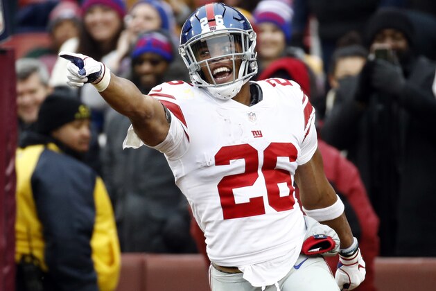 FILE - In this Sunday, Dec. 9, 2018 file photo,New York Giants running back Saquon Barkley (26) celebrates his 78-yard touchdown during the first half of an NFL football game against the Washington Redskins in Landover, Md. How popular is Saquon Barkley? Well, lots of fans want to look like him. Enough so that Barkley tops the DICK'S Sporting Goods Jersey report for sales. (AP Photo/Patrick Semansky, File)