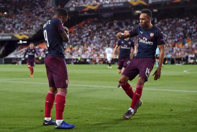 VALENCIA, SPAIN - MAY 09:  Pierre-Emerick Aubameyang of Arsenal (14) celebrates after scoring his team's first goal with Alexandre Lacazette during the UEFA Europa League Semi Final Second Leg match between Valencia and Arsenal at Estadio Mestalla on May 09, 2019 in Valencia, Spain. (Photo by Alex Caparros/Getty Images)