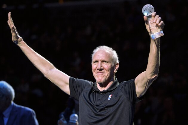 Bill Walton raises his hands as he stands with fellow recipients of the annual National Civil Rights Museum Sports Legacy Award before the annual Martin Luther King Jr. Celebration Game between the New Orleans Pelicans and the Memphis Grizzlies Monday, Jan. 21, 2019, in Memphis, Tenn. Wayne Embry, Candace Parker, and Chris Bosh were also honored. (AP Photo/Brandon Dill)