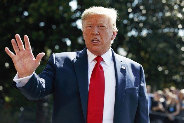 President Donald Trump talks to reporters on the South Lawn of the White House, Friday, Aug. 9, 2019, in Washington, as he prepares to leave Washington for his annual August holiday at his New Jersey golf club.  (AP Photo/Evan Vucci)
