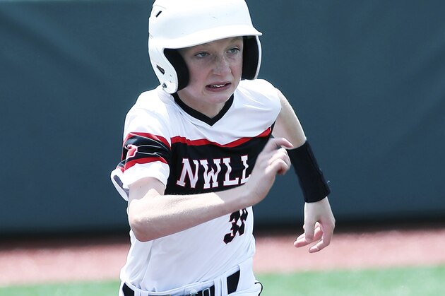 Bay City Michigan's Nick Naylor runs the first base during a Little League regional tournament baseball game, Monday, Aug. 5, 2019, in Westfield, Ind. (AP Photo/Tony Tribble)