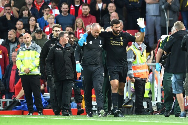 LIVERPOOL, ENGLAND - AUGUST 09: Alisson Becker of Liverpool leaves the pitch following an injury during the Premier League match between Liverpool FC and Norwich City at Anfield on August 09, 2019 in Liverpool, United Kingdom. (Photo by Michael Regan/Getty Images)