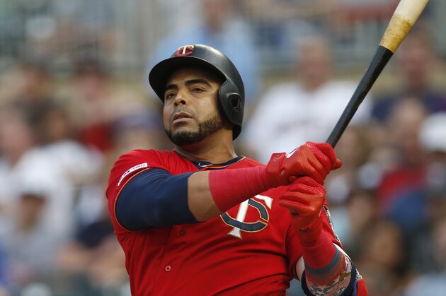 Minnesota Twins' Nelson Cruz bats against the Kansas City Royals in the first inning of a baseball game Friday, Aug. 2, 2019, in Minneapolis. (AP Photo/Jim Mone)