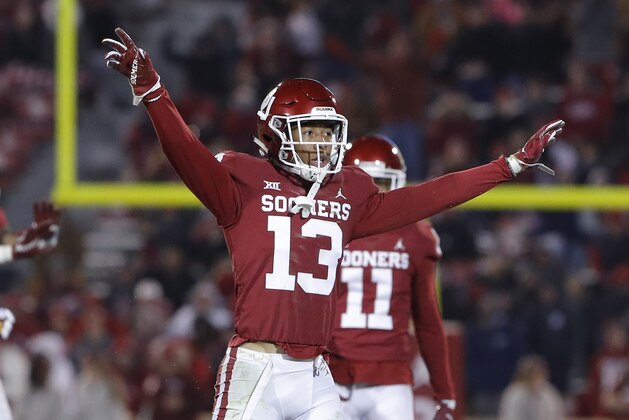 Oklahoma cornerback Tre Norwood (13) reacts following a play against Kansas in the second half of an NCAA college football game in Norman, Okla., Saturday, Nov. 17, 2018. Oklahoma won 55-40. (AP Photo/Alonzo Adams)