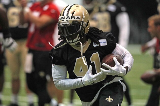 New Orleans Saints running back Alvin Kamara (41) runs through drills during an NFL football practice in Metairie, La., Tuesday, June 4, 2019. (AP Photo/Gerald Herbert)
