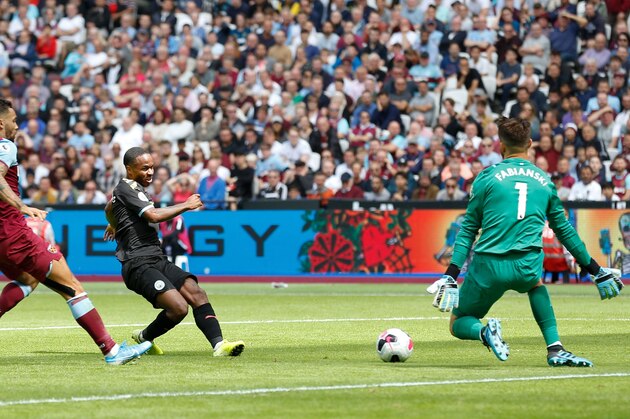 Manchester City's English midfielder Raheem Sterling (C) scores their second goal during the English Premier League football match between West Ham United and Manchester City at The London Stadium, in east London on August 10, 2019. (Photo by Ian KINGTON / AFP) / RESTRICTED TO EDITORIAL USE. No use with unauthorized audio, video, data, fixture lists, club/league logos or 'live' services. Online in-match use limited to 120 images. An additional 40 images may be used in extra time. No video emulation. Social media in-match use limited to 120 images. An additional 40 images may be used in extra time. No use in betting publications, games or single club/league/player publications. /         (Photo credit should read IAN KINGTON/AFP/Getty Images)