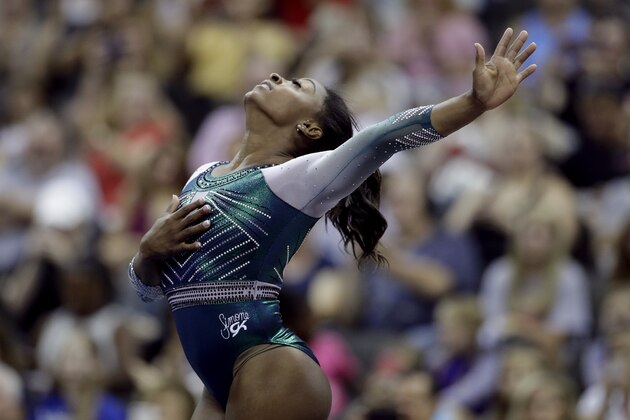Simone Biles competes on the floor exercise at the U.S. Gymnastics Championships on Friday, Aug. 9, 2019, in Kansas City, Mo. (AP Photo/Charlie Riedel)