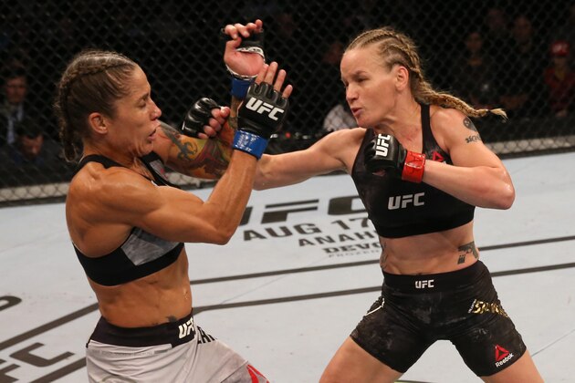 MONTEVIDEO, URUGUAY - AUGUST 10:  (R-L) Valentina Shevchenko of Kyrgyzstan punches Liz Carmouche in their UFC women's flyweight championship fight during the UFC Fight Night event at Antel Arena on August 10, 2019 in Montevideo, Uruguay. (Photo by Alexandre Schneider /Zuffa LLC/Zuffa LLC)