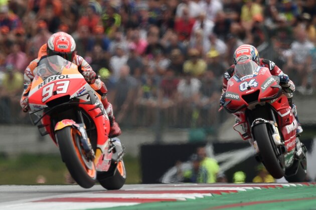 Repsol Honda Team's Spanish rider Marc Marquez (L) and Mission Winnow Ducati's Italian rider Andrea Dovizioso ride their motorbikes during the race of the Austrian Moto GP Grand Prix in Spielberg on August 11, 2019 (Photo by VLADIMIR SIMICEK / AFP)        (Photo credit should read VLADIMIR SIMICEK/AFP/Getty Images)