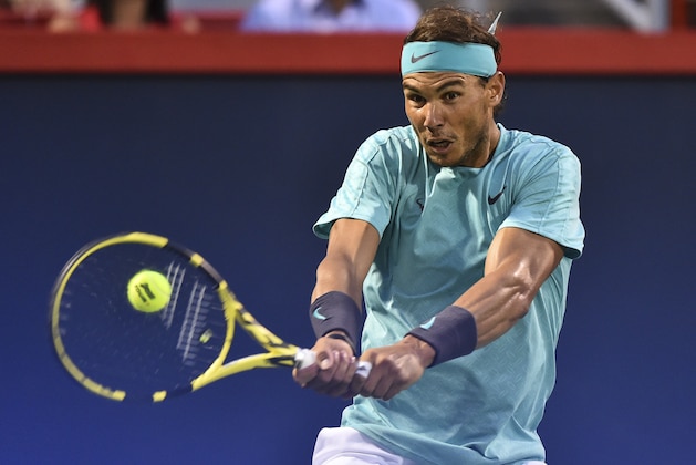 MONTREAL, QC - AUGUST 09:  Rafael Nadal of Spain hits the ball against Fabio Fognini of Italy during day 8 of the Rogers Cup at IGA Stadium on August 9, 2019 in Montreal, Quebec, Canada.  (Photo by Minas Panagiotakis/Getty Images)