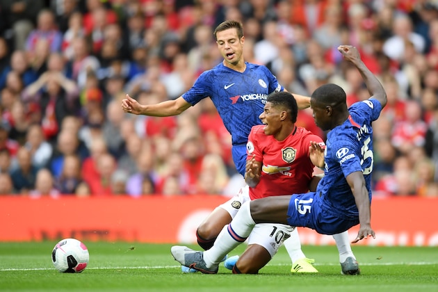 MANCHESTER, ENGLAND - AUGUST 11: Marcus Rashford of Manchester United is challenged by Kurt Zouma of Chelsea which leads to a penalty for Manchester United during the Premier League match between Manchester United and Chelsea FC at Old Trafford on August 11, 2019 in Manchester, United Kingdom. (Photo by Michael Regan/Getty Images)