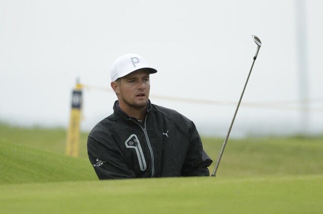 Bryson DeChambeau of the United States chips onto the 15th green during a practice round ahead of the start of the British Open golf championships at Royal Portrush in Northern Ireland, Wednesday, July 17, 2019. The British Open starts Thursday. (AP Photo/Matt Dunham)