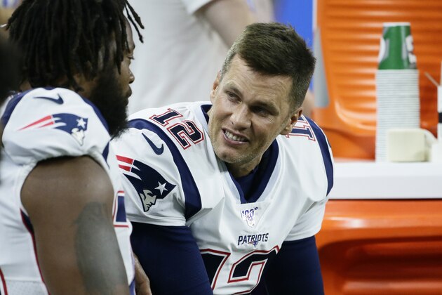New England Patriots quarterback Tom Brady talks to a teammate on the bench during the first half of a preseason NFL football game against the Detroit Lions, Thursday, Aug. 8, 2019, in Detroit. (AP Photo/Duane Burleson)