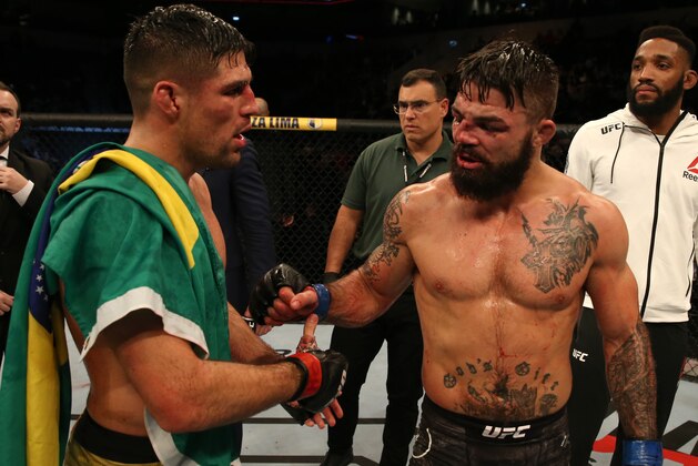 MONTEVIDEO, URUGUAY - AUGUST 10:  (L-R) Vicente Luque and Mike Perry talk after their welterweight fight during the UFC Fight Night event at Antel Arena on August 10, 2019 in Montevideo, Uruguay. (Photo by Alexandre Schneider /Zuffa LLC/Zuffa LLC)