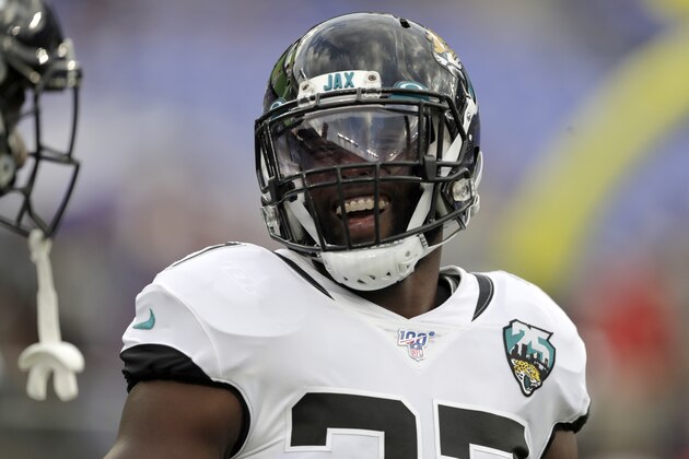 Jacksonville Jaguars running back Leonard Fournette reacts while talking to teammates prior to an NFL football preseason game against the Baltimore Ravens, Thursday, Aug. 8, 2019, in Baltimore. (AP Photo/Julio Cortez)