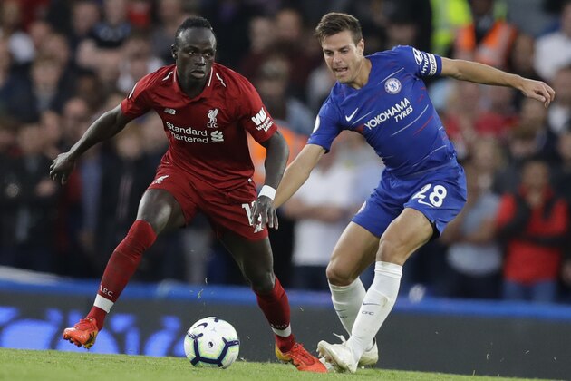 Chelsea's Cesar Azpilicueta, right, and Liverpool's Daniel Sturridge vie for the ball during the English Premier League soccer match between Chelsea and Liverpool at Stamford Bridge stadium in London, Saturday, Sept. 29, 2018. (AP Photo/Kirsty Wigglesworth)