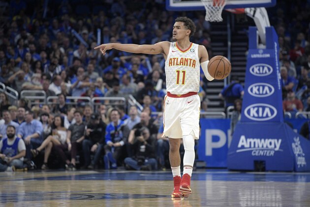 Atlanta Hawks guard Trae Young (11) sets up a play during the second half of an NBA basketball game against the Orlando Magic Friday, April 5, 2019, in Orlando, Fla. (AP Photo/Phelan M. Ebenhack)