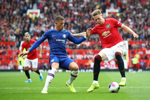 MANCHESTER, ENGLAND - AUGUST 11: Scott McTominay of Manchester United challenges for the ball with Ross Barkley of Chelsea during the Premier League match between Manchester United and Chelsea FC at Old Trafford on August 11, 2019 in Manchester, United Kingdom. (Photo by Julian Finney/Getty Images)