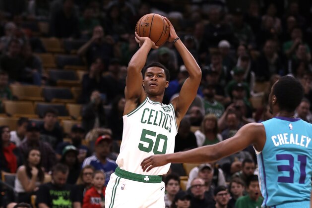 Boston Celtics guard PJ Dozier (50) shoots during the second half of a preseason basketball game in Boston, Sunday, Sept. 30, 2018. The Celtics defeated the Hornets 115-112. (AP Photo/Charles Krupa)
