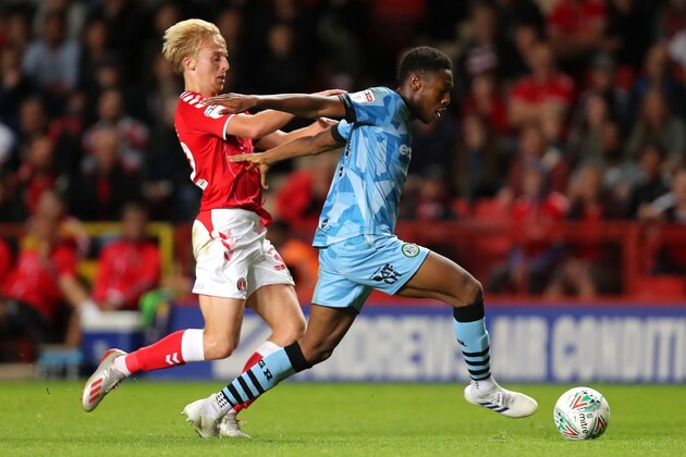 LONDON, ENGLAND - AUGUST 13: Ebou Adams of Forest Green Rovers is challenged by George Lapslie of Charlton Athletic during the Carabao Cup First Round match between Charlton Athletic and Forest Green Rovers at The Valley on August 13, 2019 in London, England. (Photo by James Chance/Getty Images)