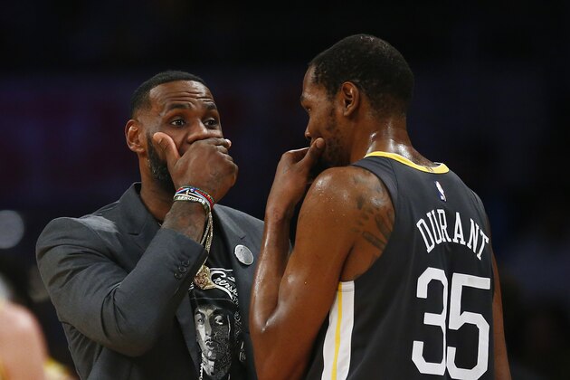 LOS ANGELES, CALIFORNIA - APRIL 04: LeBron James #23 of the Los Angeles Lakers speaks to Kevin Durant #35 of the Golden State Warriors during a timeout in the first half at Staples Center on April 04, 2019 in Los Angeles, California. NOTE TO USER: User expressly acknowledges and agrees that, by downloading and or using this photograph, User is consenting to the terms and conditions of the Getty Images License Agreement. (Photo by Yong Teck Lim/Getty Images)
