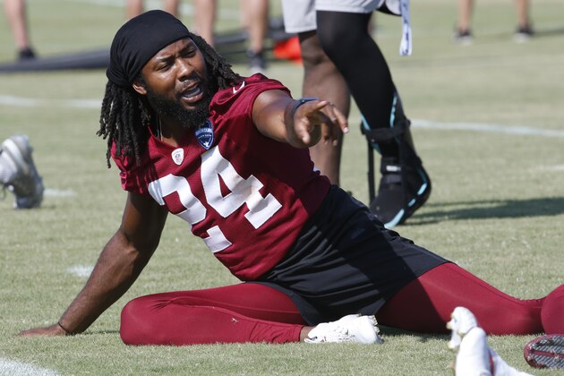 Washington Redskins cornerback Josh Norman (24) points to a teammate during the Redskins NFL football training camp in Richmond, Va., Thursday, Aug. 1, 2019. (AP Photo/Steve Helber)