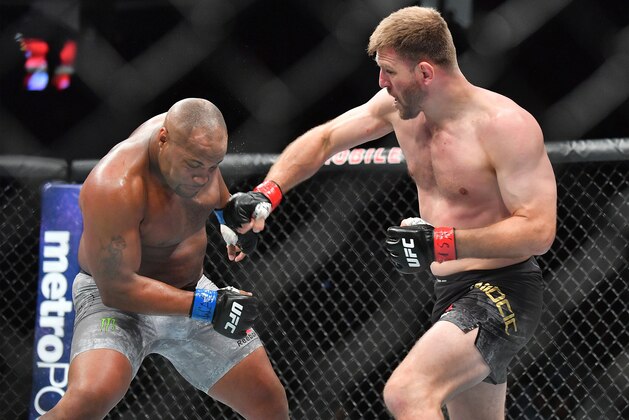 LAS VEGAS, NV - JULY 07:  Stipe Miocic (R) throws a punch against Daniel Cormier during their heavyweight championship fight at T-Mobile Arena on July 7, 2018 in Las Vegas, Nevada. Cormier won by first round knockout.  (Photo by Sam Wasson/Getty Images)