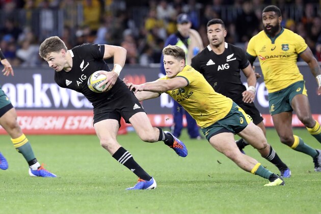 New Zealand's Beauden Barrett escapes the clutches of Australia's James O'Connor during their rugby union test match in Perth, Australia, Saturday, Aug. 10, 2019. (AP Photo/Trevor Collens)
