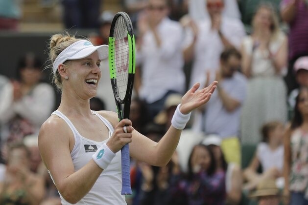United States' Alison Riske celebrates defeating Australia's Ashleigh Barty in a women's singles match during day seven of the Wimbledon Tennis Championships in London, Monday, July 8, 2019. (AP Photo/Ben Curtis)